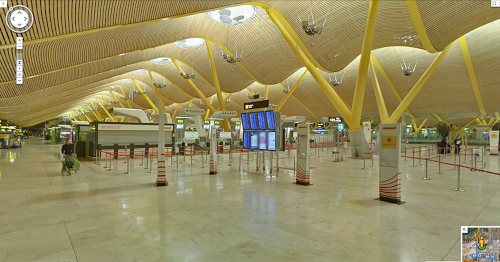 a large airport terminal with yellow beams