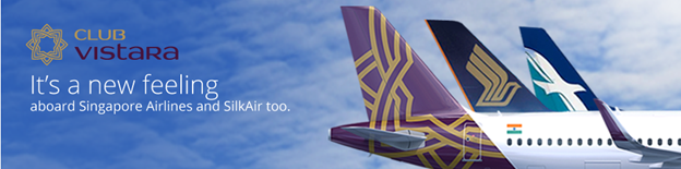 a purple and yellow tail of an airplane